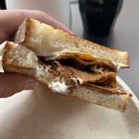 Ham, cheese and tomato toastie with aioli   at Shift Eatery in Surry Hills