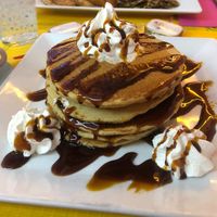 Pancakes with caramel syrup and whipped cream  at Freedom Cakes Bakery in Madrid