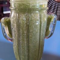 Green Power Smoothie in a fun glass at Freedom Cakes Bakery in Madrid