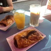 Napolitana de chocolate, café con leche y hielo, zumo natural de naranja  at Freedom Cakes Bakery in Madrid