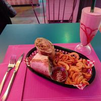 Kebab, curly fries and strawberry milkshake at Freedom Cakes Bakery in Madrid