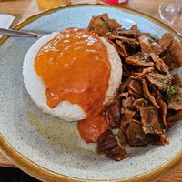 'Crispy Seitan' with rice & Portuguese sauce (14€) there's a salad buffet included to enrich the dish at Petiscaria in Helsinki