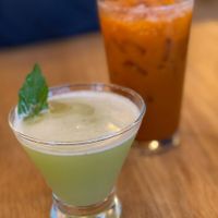 The Gardener's Delight gin cocktail & Thai iced tea at Kati Vegan Thai in Seattle