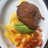 Half portion of nachos - 9 dollars   at Cafe Mosaico in Quito