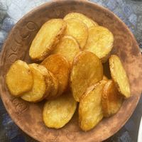 Portion of over fried Greek fries   at Cafe Mosaico in Quito