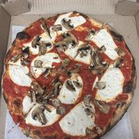 Small vegan cheese pizza with fresh mushrooms  at GG's Wood Fired Pizza in Milford