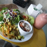 Prato do dia: Almondegas do chef ao sugo e queijo de castanha acompanhada de salada. Smothie rosa:  morango, maça, banana, limão e amendoa.  at Bigode Verde in Recife