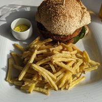 Vegetable burger with fries at Ribeira d'Ilhas Beach in Ericeira