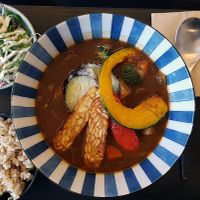 Vegetable curry served with brown rice and a salad at Soiroum in Seoul