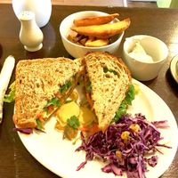 Vegan ploughmans sandwich with wedges at Crocus Cafe in Nottingham