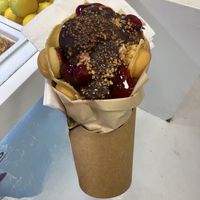 Vegan bubble waffle with strawberry and lemon ice cream, cherries, crocant and chocolate 😋  at Royo in Rhodes