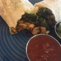 Breakfast burrito with tofu, potatoes, spinach, onion, avocado, pesto at Bentley's House of Coffee & Tea in Tucson