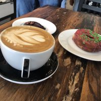 Oat milk lattes and a blueberry donut  at Timeless Coffee Roasters and Bakery in Berkeley