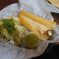 Bean and veggie taco topped with lettuce, salsa verde, avocado and shredded cabbage

New World tamale - zuchini, potatoes, roasted tomatoes, onions and pepitas

Served with salsa verde

All vegan and gluten free at Spanglish in Traverse City