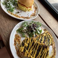 Left: Cheesus Burger, Right: Cheesy Veganmite Turmeric Toast at The Front Room Cafe in Hervey Bay