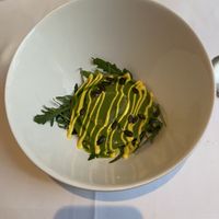 Spinach filled ravioli with rocket salad and a tasty lovage broth  at Gauthier Soho in London