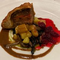 Christmas pathivier with with turnip, mushrooms and cranberries with a red wine jus and parsley sauce.  at Gauthier Soho in London