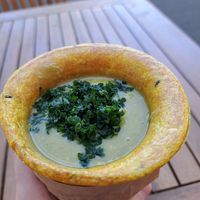 Pea and edamame soup with parsley on top at Soup Culture in Kosice