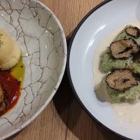 Stuffed cabbage (left) gnochis with truffle cream (half eaten) at Gaudi&Naan in Ljubljana