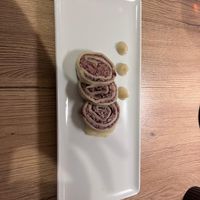 Struklji - a traditional Slovenian dish veganified. A bean paste wrapped in dough with onion puree and sauerkraut at Gaudi&Naan in Ljubljana