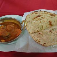 Vegetables Jalfrezi and Lacha Paratha. (Green spots are reflections from street light) at Bollywood Indian Restaurant in Simi Valley