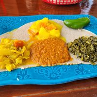Cabbage, collard greens potatoes and spicy lentils with jalapeno pepper at Amy's Ethiopian in Nashville