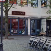 Café entrance and outdoor seating area at Moccachili in Saarbrucken