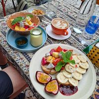 Vegan granola and Toast with almond butter and fruit at Nook Eatery in Hue
