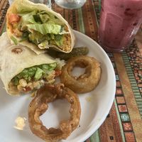 greek wrap, tofu/jackfruit bao, berry smoothie  at Nook Eatery in Hue