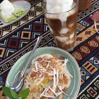 Coconut iced coffee and tapioca banana cake at Nook Eatery in Hue