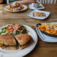 Clockwise from to left: supreme Mac & cheezy, home fries, pop tart, buffalo Mac and cheese, and southside Cubano with side salad at Two Dollar Radio Headquarters in Columbus