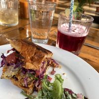 Pambazo sandwich - it’s not too spicy despite being dipped in hot sauce and baked - and the This Dress Has Pockets in it Cocktail    at Two Dollar Radio Headquarters in Columbus