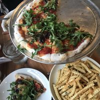 Vegan French Fries & Vegan Pile pizza w/ Cashew ricotta & gluten-free crust.  at King Dough in Indianapolis