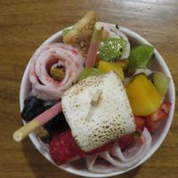 Coconut/ strawberry rolled ice cream with tropical fruit! at Momotaro in State College