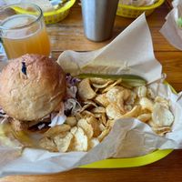 Mushroom Sandwich (Chick'n Style) with pickle spear and chips; Mulled Michigan Cider in back left corner at Detroit Street Filling Station in Ann Arbor