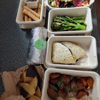From top, churros & nachos. Long stem broccoli side dish. Mushroom Burrito & Black Bean Quesadillas. Sweet potato side dish. at Wahaca in Edinburgh