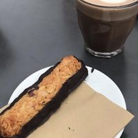 Dark chocolate Florentiner with hot chocolate and oat milk  at Kaffeerösterei in Sylt