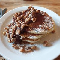 Brownie pancakes with candied nuts and chocolate sauce at Shoe Tree Cafe in Newcastle Upon Tyne