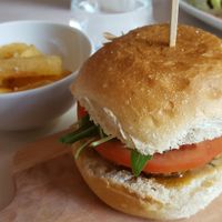 Gourmet burger and cassava chips at Essential Vegan @ Ten to One Bar in North London