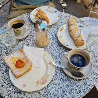Coffee and tasty sweet pastry at L'Exquisit in Mallorca