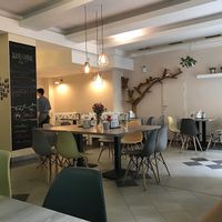 Interior and a friendly waiter in the background  at Forrest Bistro in Prague