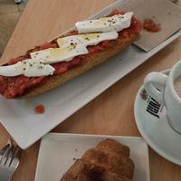 Croissant and toast with tomato and vegan camembert cheese at Vegan Bombon in Alicante