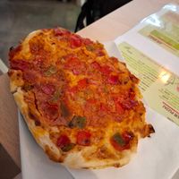 Pizza slice at Vegan Bombon in Alicante
