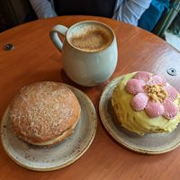Chai, pistachio donut and strawberry filled donut at Bite Me Cafe in Madrid