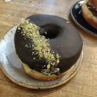 Pistachio chocolate doughnut at Bite Me Cafe in Madrid