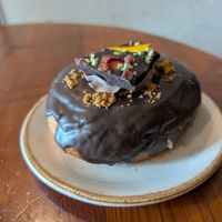 Pistachio and chocolate donut at Bite Me Cafe in Madrid