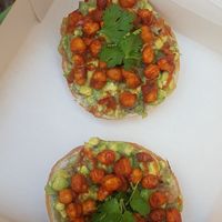 Spicy chickpea and guacamole bagel at Bite Me Cafe in Madrid