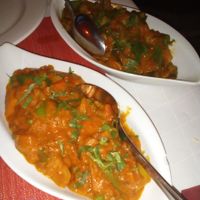 Mix vegetables with Curry in front and Orkra with spicy sauce in the black. at Annapurna in Fuessen