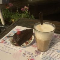 The vegan chocolate cake and oat latte. at De Laatste Kruimel - Langebrugsteeg in Amsterdam
