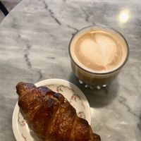 Vegan croissant and oat milk cappuccino  at De Laatste Kruimel - Langebrugsteeg in Amsterdam